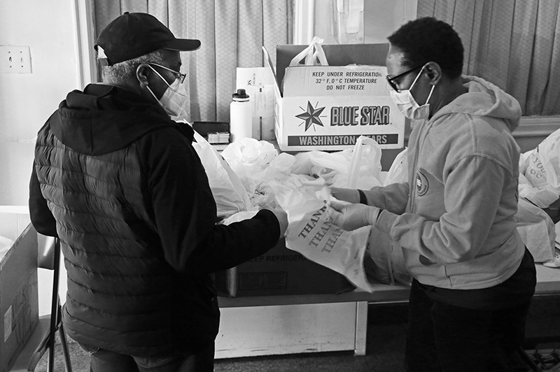 2020 : Food Lines : Seventh Day Adventists Help the Needy : Streetlife : New York City : Times Square : Richard Moore : Photographer : Photojournalist